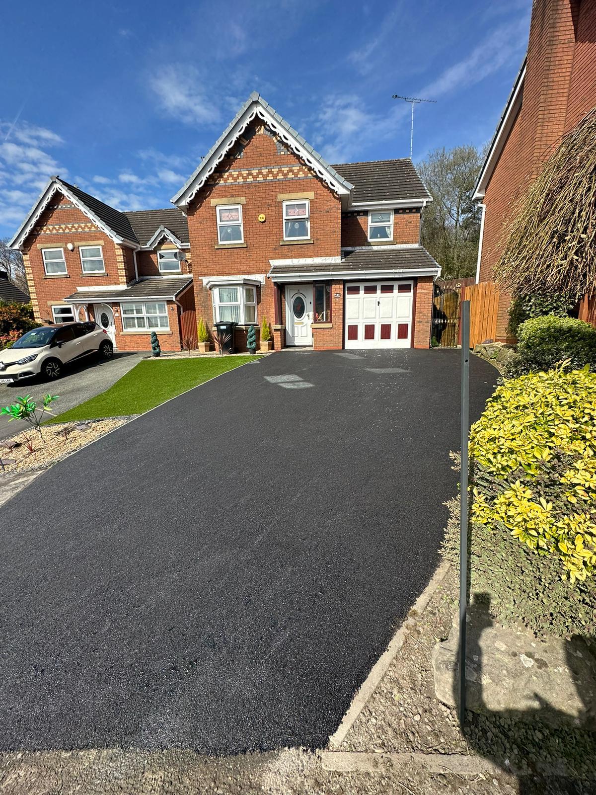 Tarmac driveway contractors completing surfacing work